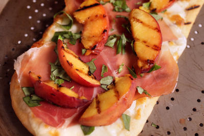 GRILLED PEACH PIZZAS WITH PROSCIUTTO